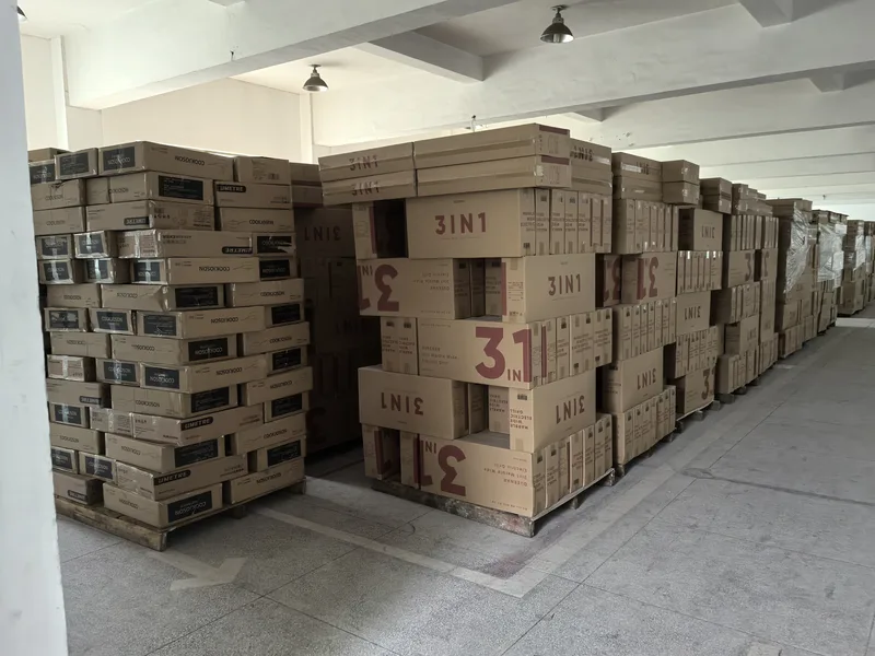 Cartons stacked on pallets inside the warehouse