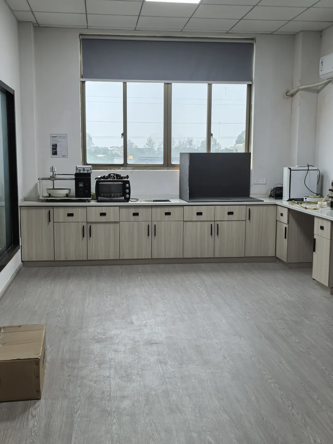 Laboratory cabinets and instruments beside the window