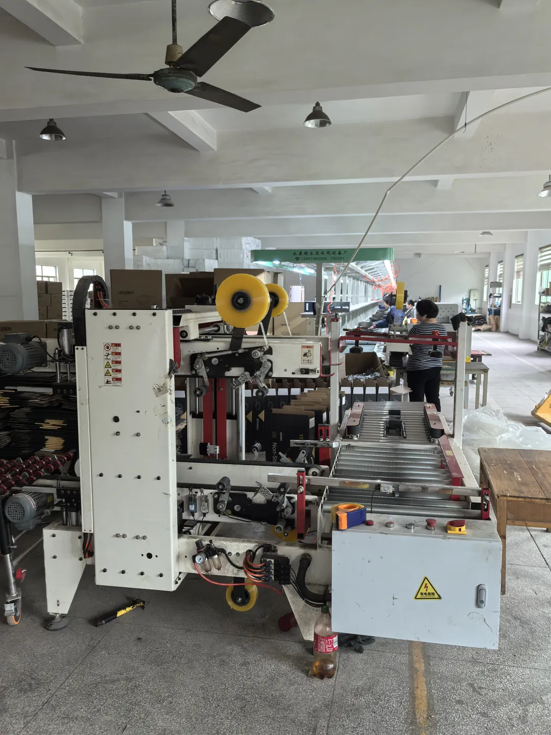 Packing equipment and conveyors inside the assembly workshop