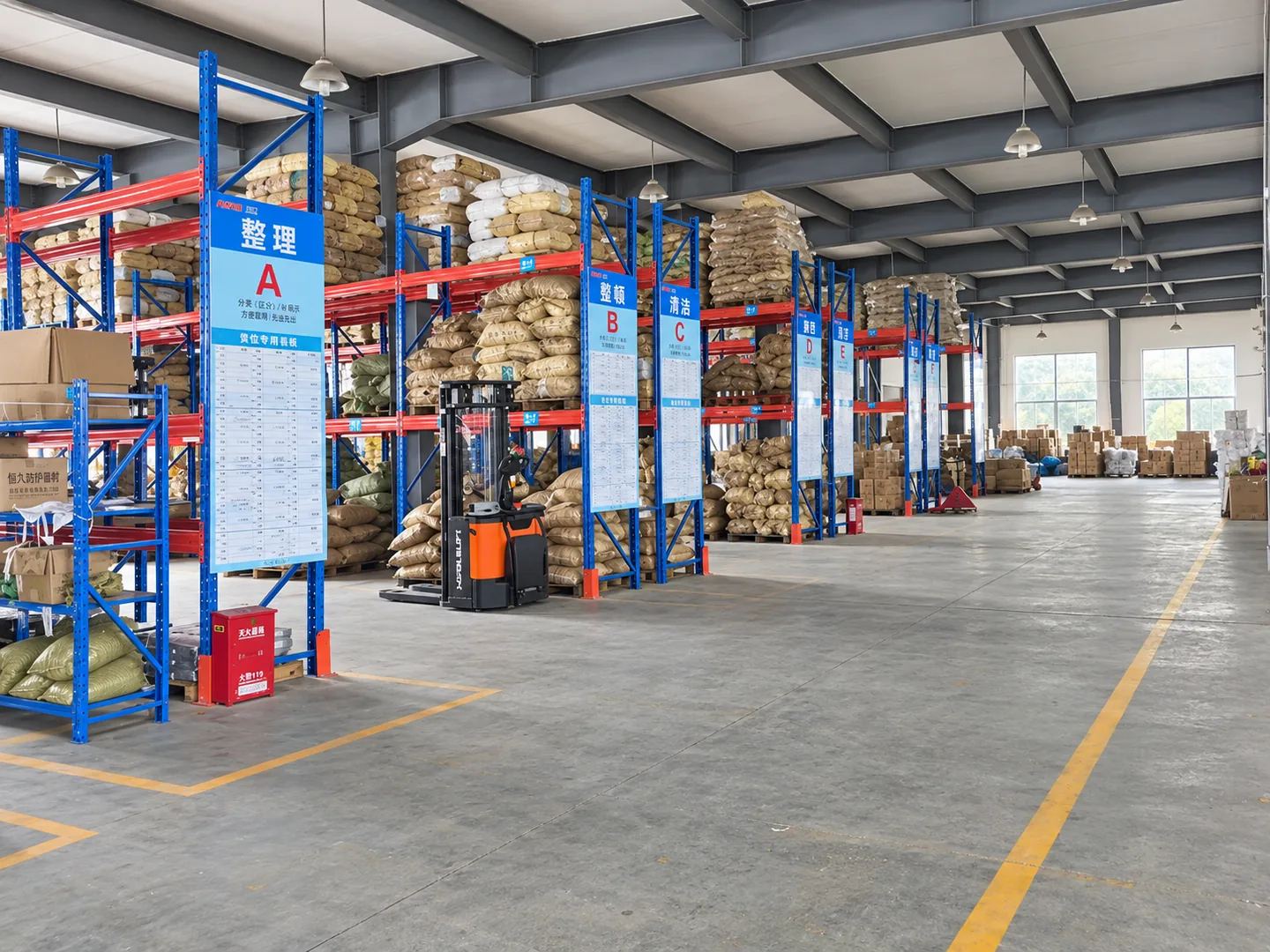 Storage racks and material bags beside the warehouse aisle