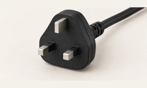 Type G plug illustration with three rectangular pins in a triangular layout.